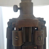 Classic lampshade on antique surveyor tripod