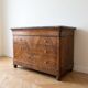 Antique walnut commode with a grey marble top.