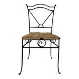 Wrought iron chair with woven seat