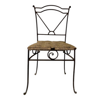 Wrought iron chair with woven seat
