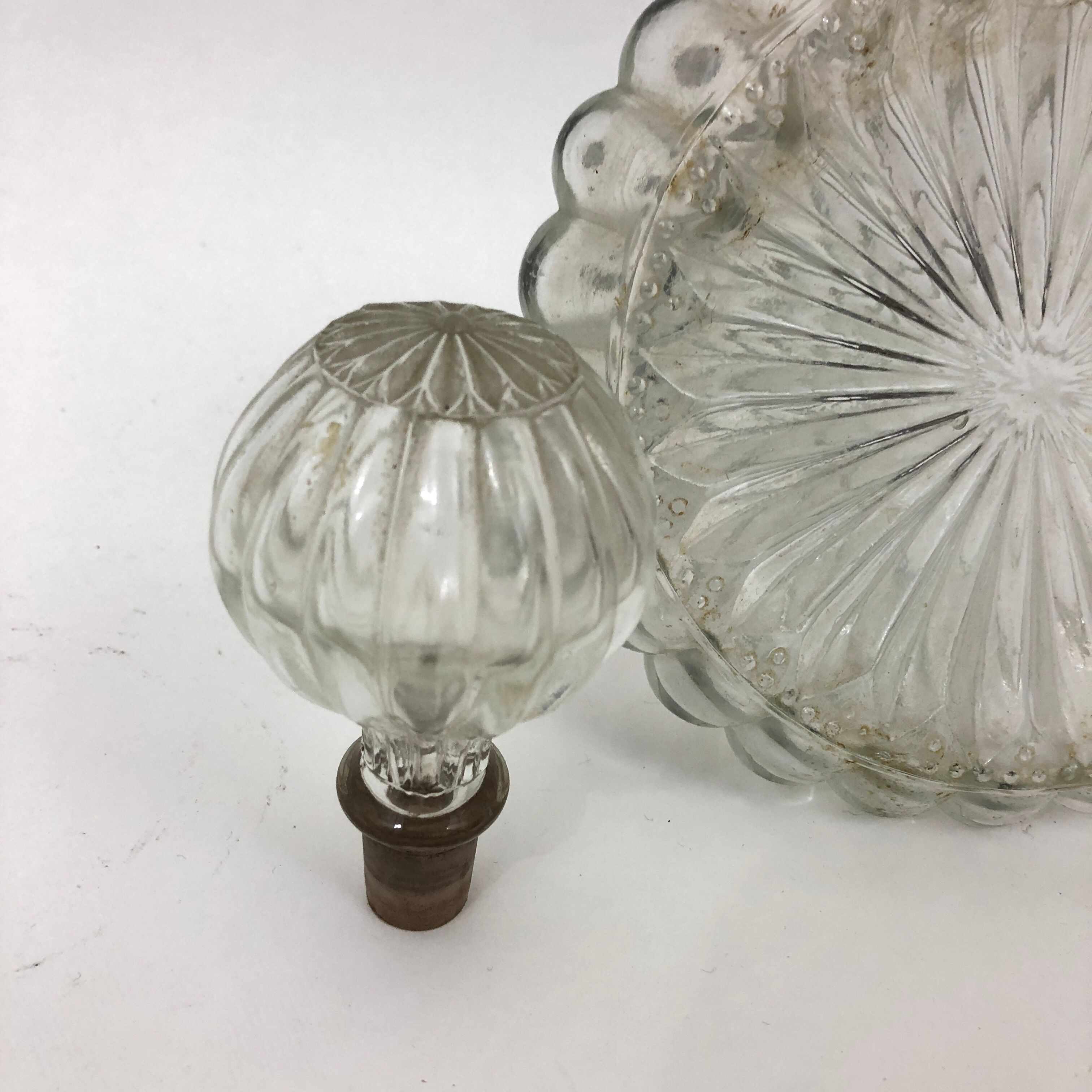 Large glass decanter and tin ring