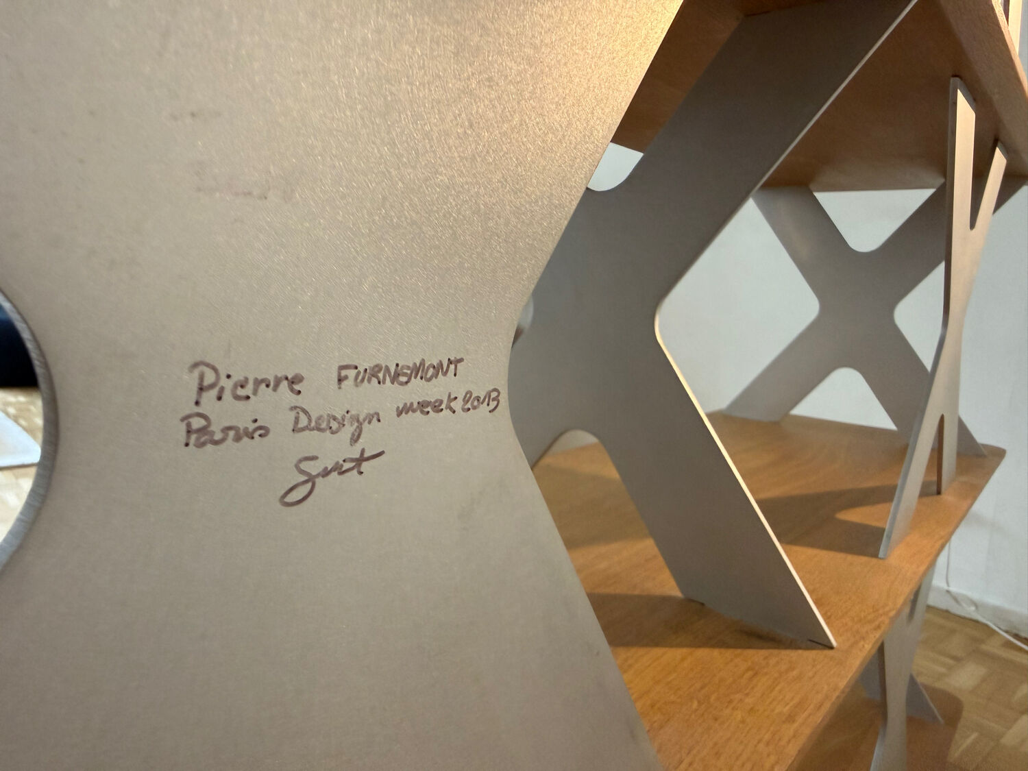 Designer shelf in solid oak and signed aluminium.