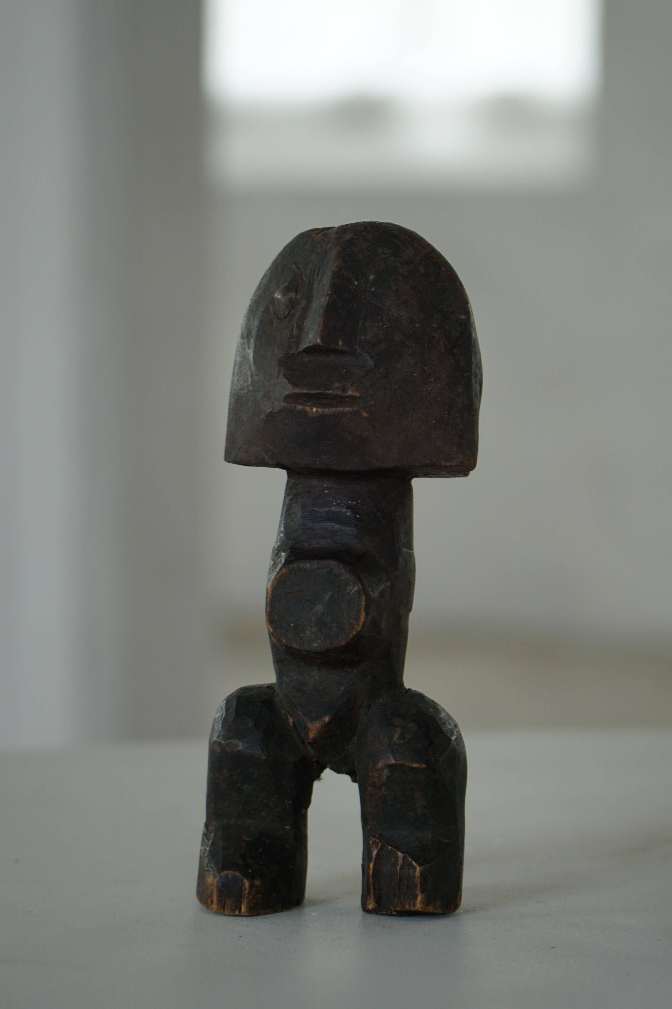 Set of 4 decorative handcrafted African wooden sculptures, mid-century.