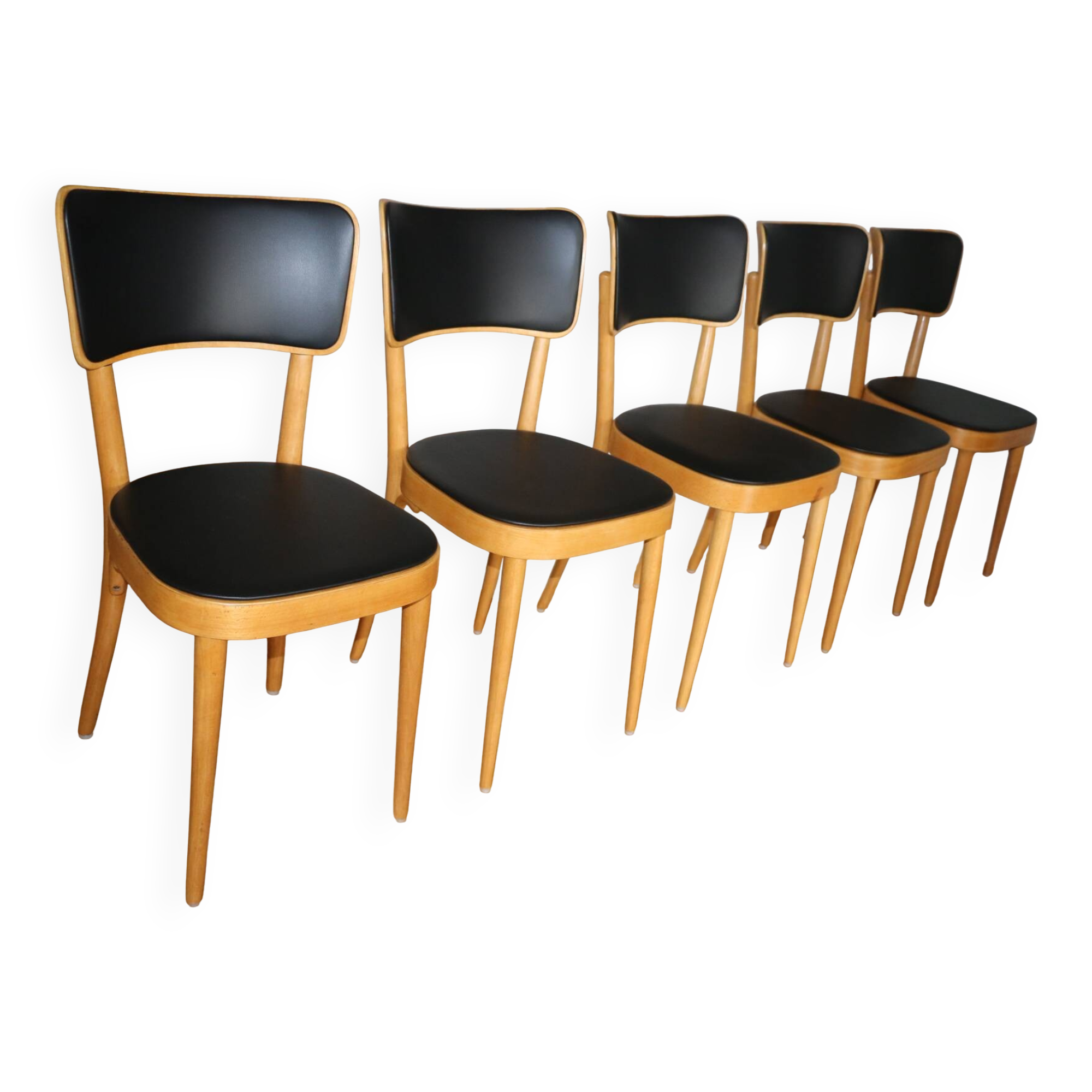 5 baumann chairs with large backs in black faux leather.