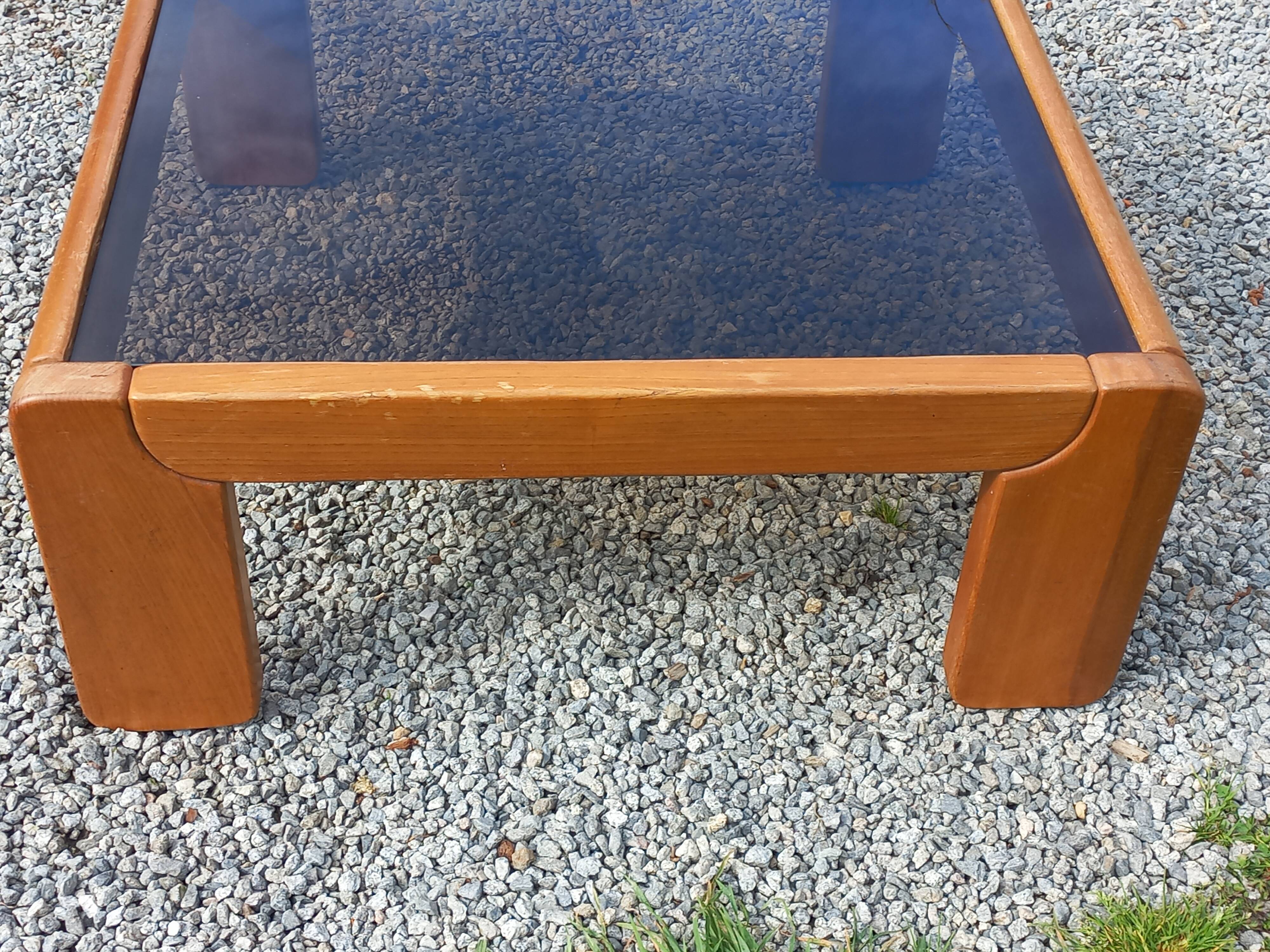 Coffee table from Regain in solid elm with a smoked glass top.