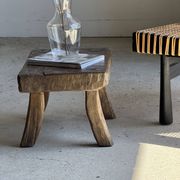 Small stool, rectangular solid teak side table with curved legs.