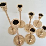 Series of seven candle holders solid brass