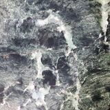 Low marble and black metal table