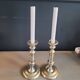 Pair of antique silver-plated brass candlesticks