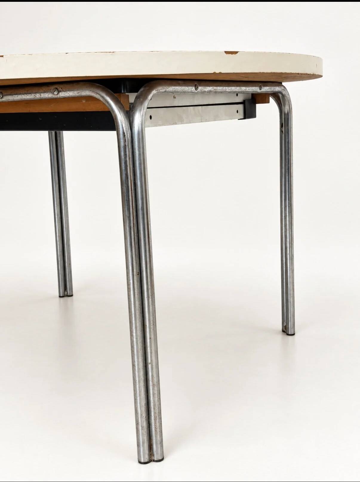 Vintage round extendable dining table, white laminate on chrome legs.