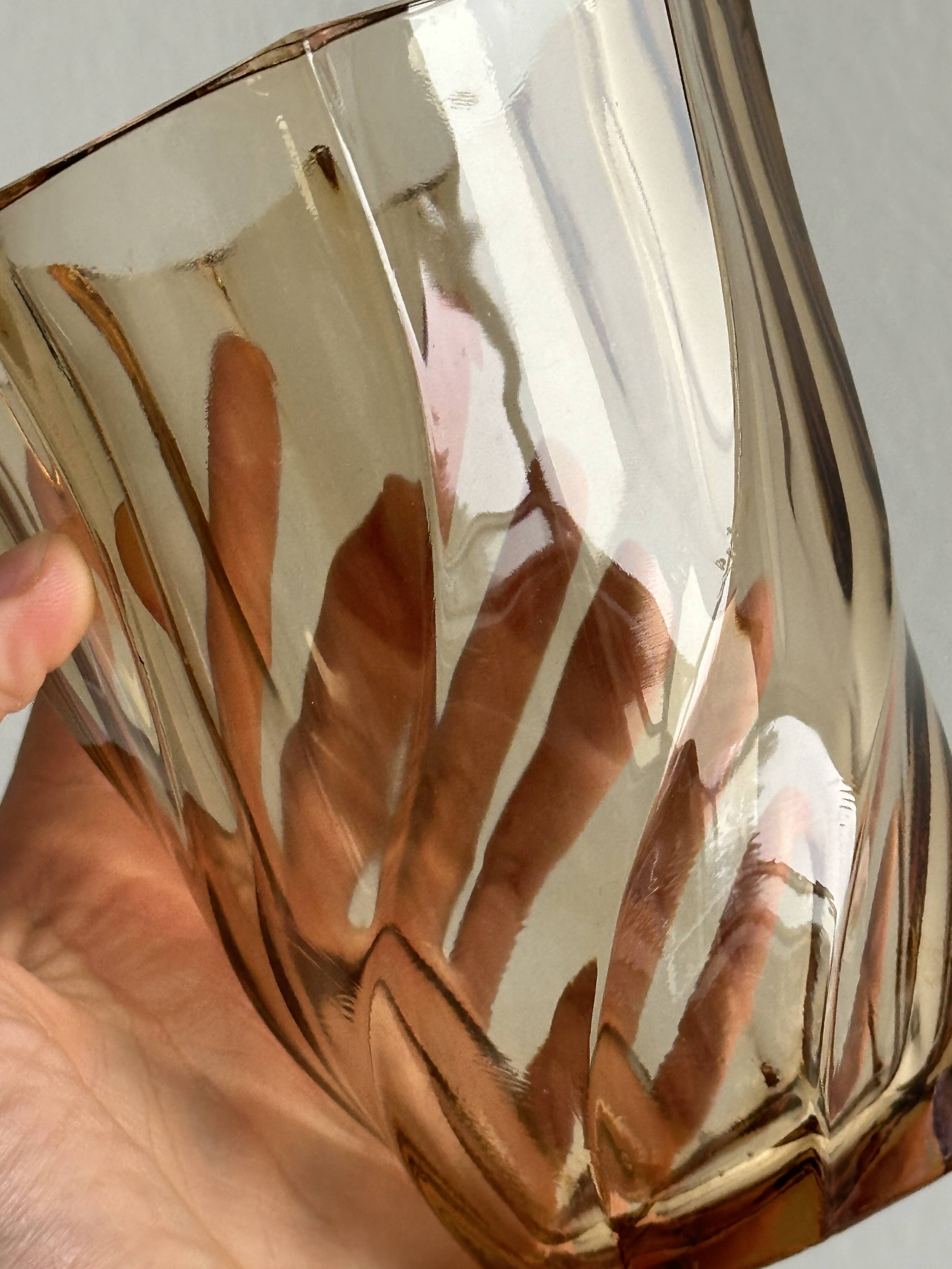 Small translucent pink twisted glass vase