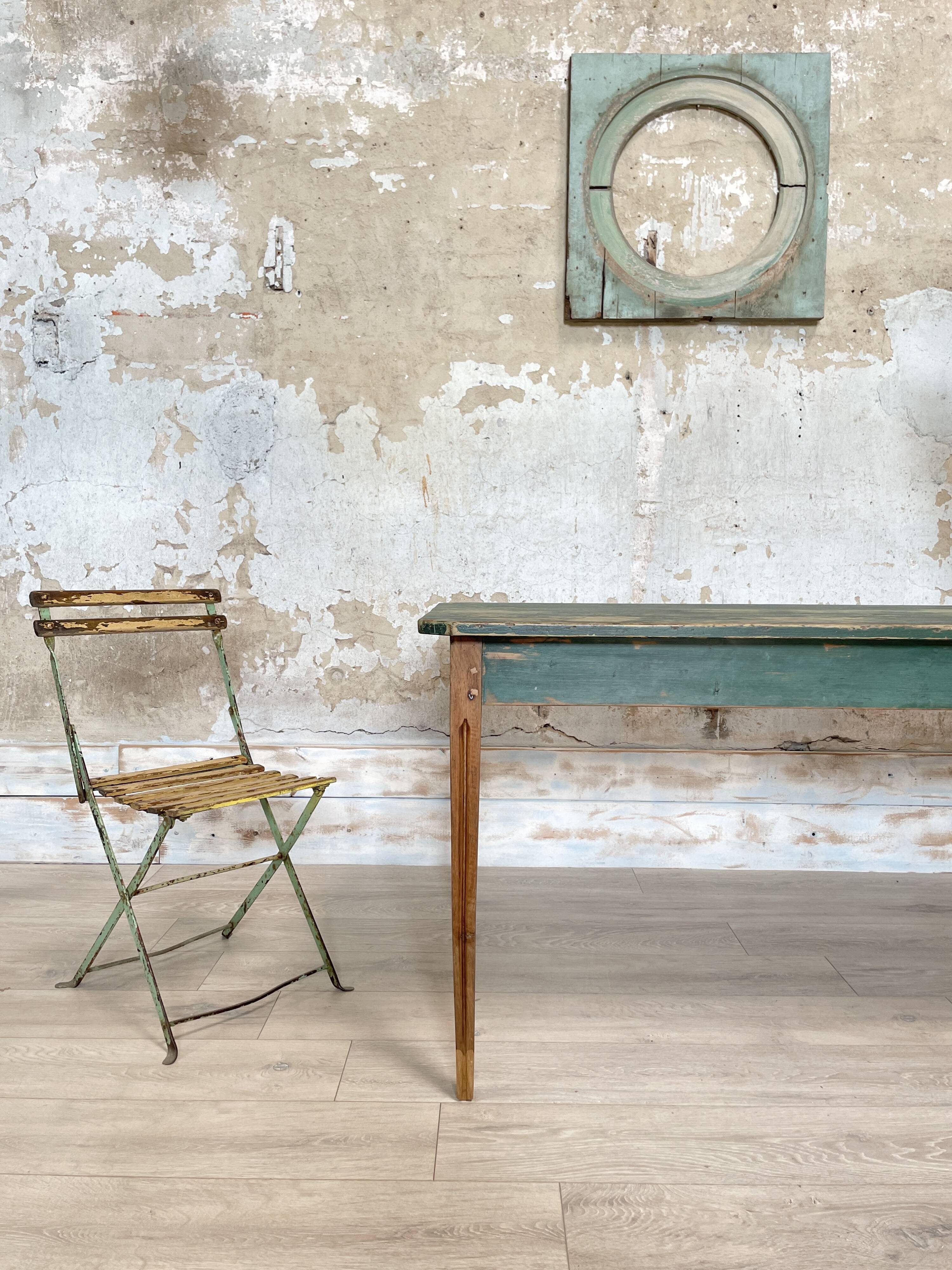 Vintage farm table with spindle legs.