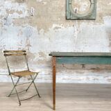 Vintage farm table with spindle legs.