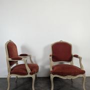 Pair of red cabriolet armchairs in Louis XV style