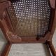 Art Deco caned chair with bronze ornaments.