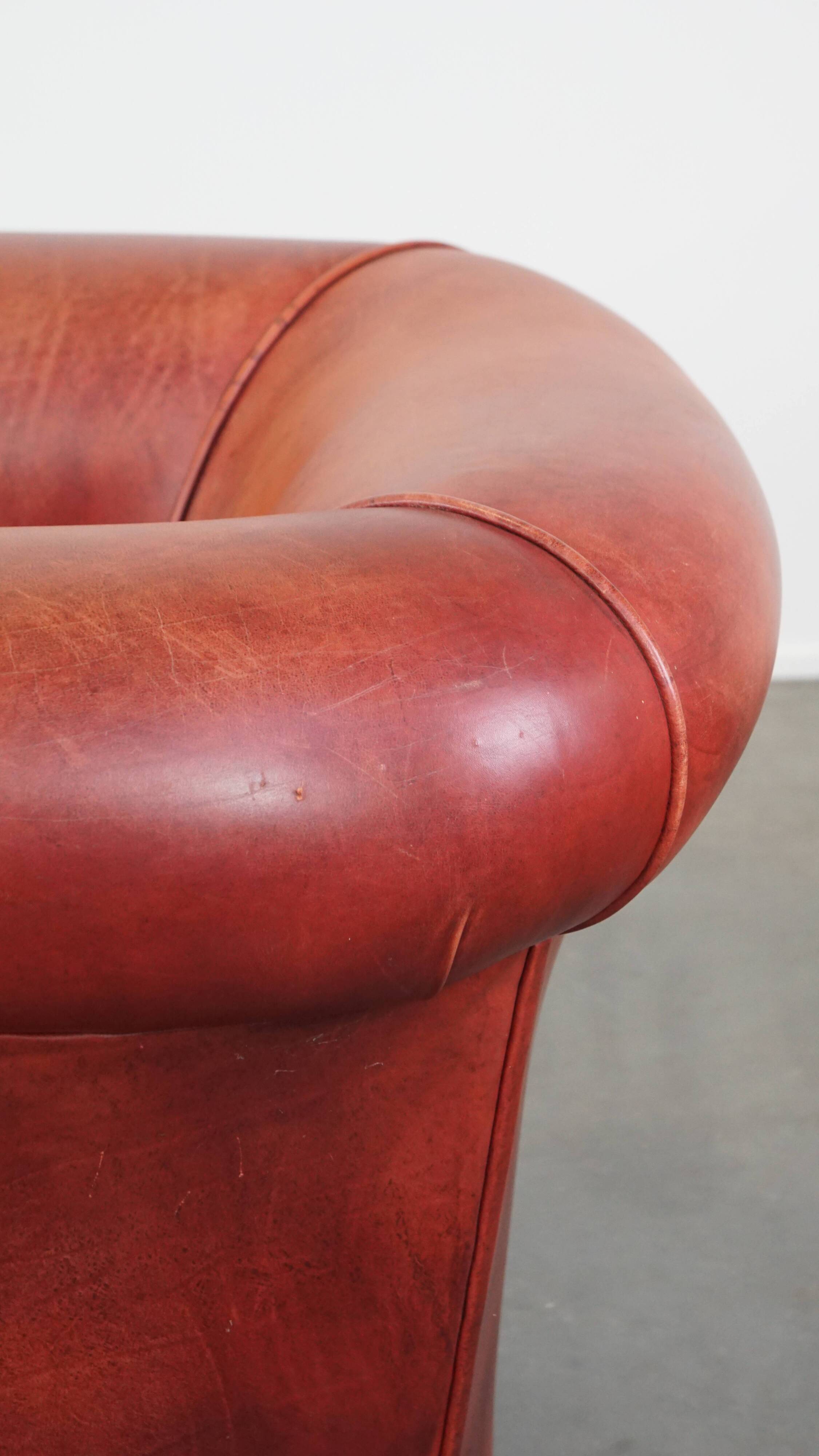 English Chesterfield club chair in light red cowhide leather
