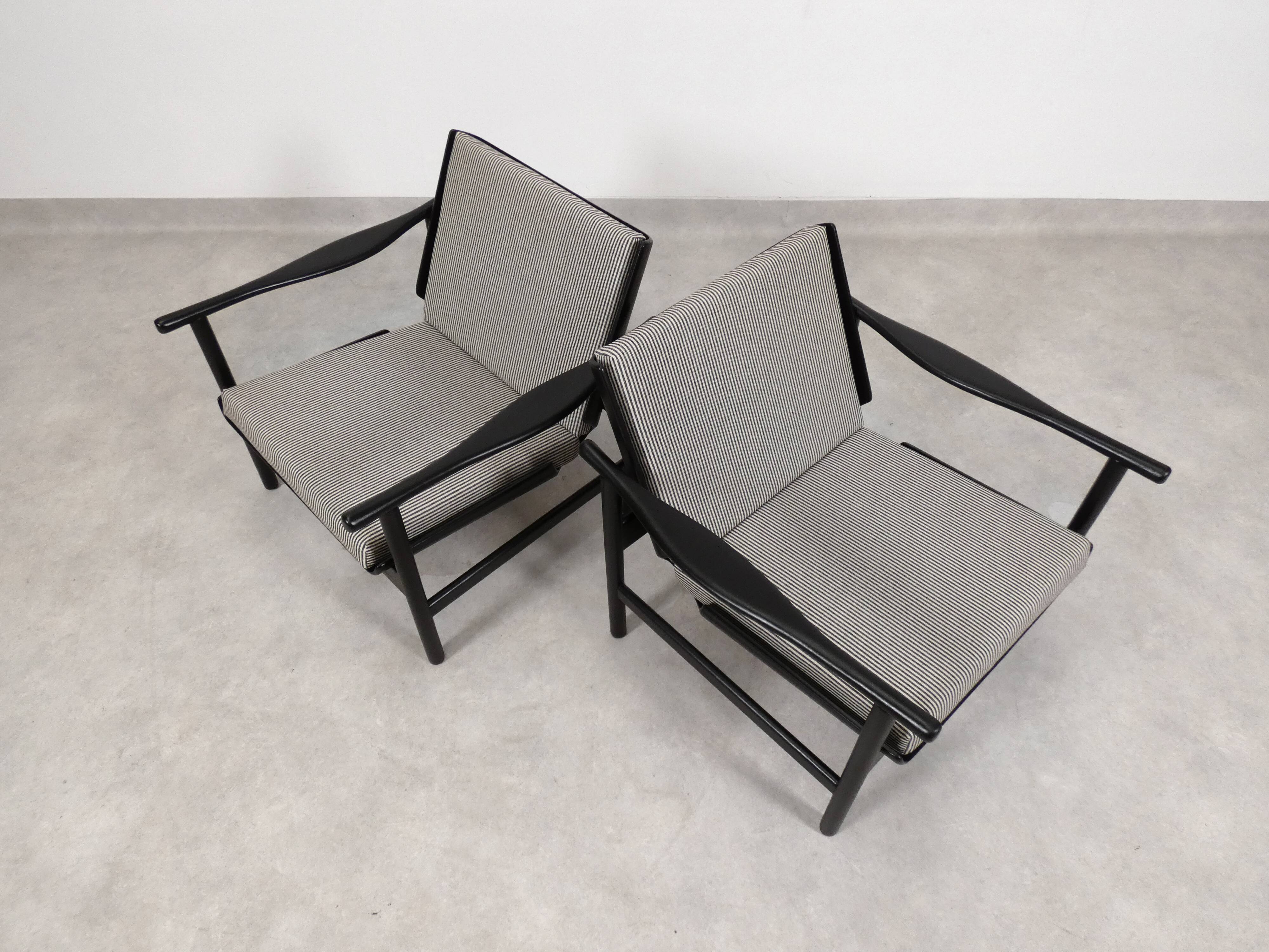 2x wooden Scandinavian arm chairs