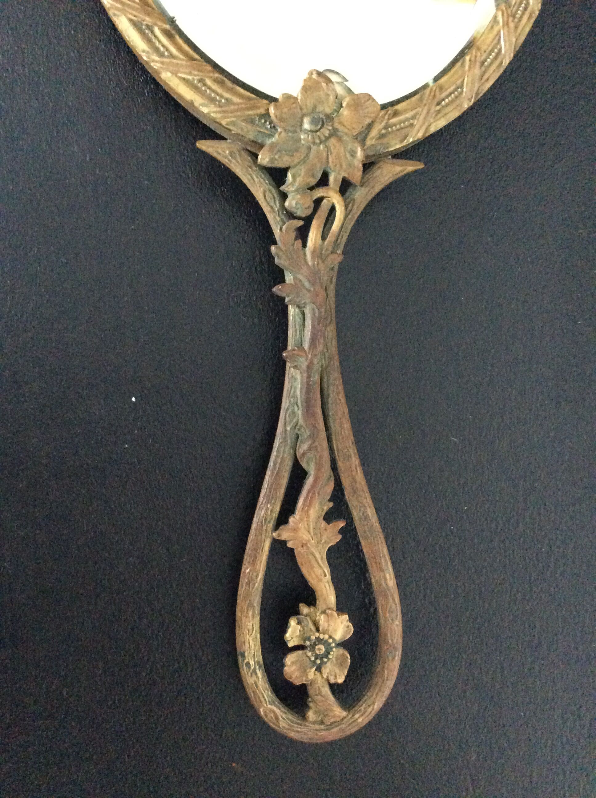 Art Deco hand-facing mirror in bronze and beveled ice