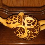 Elephant teapot decorated with giraffe cheetah, signed by the brand elephant 1896