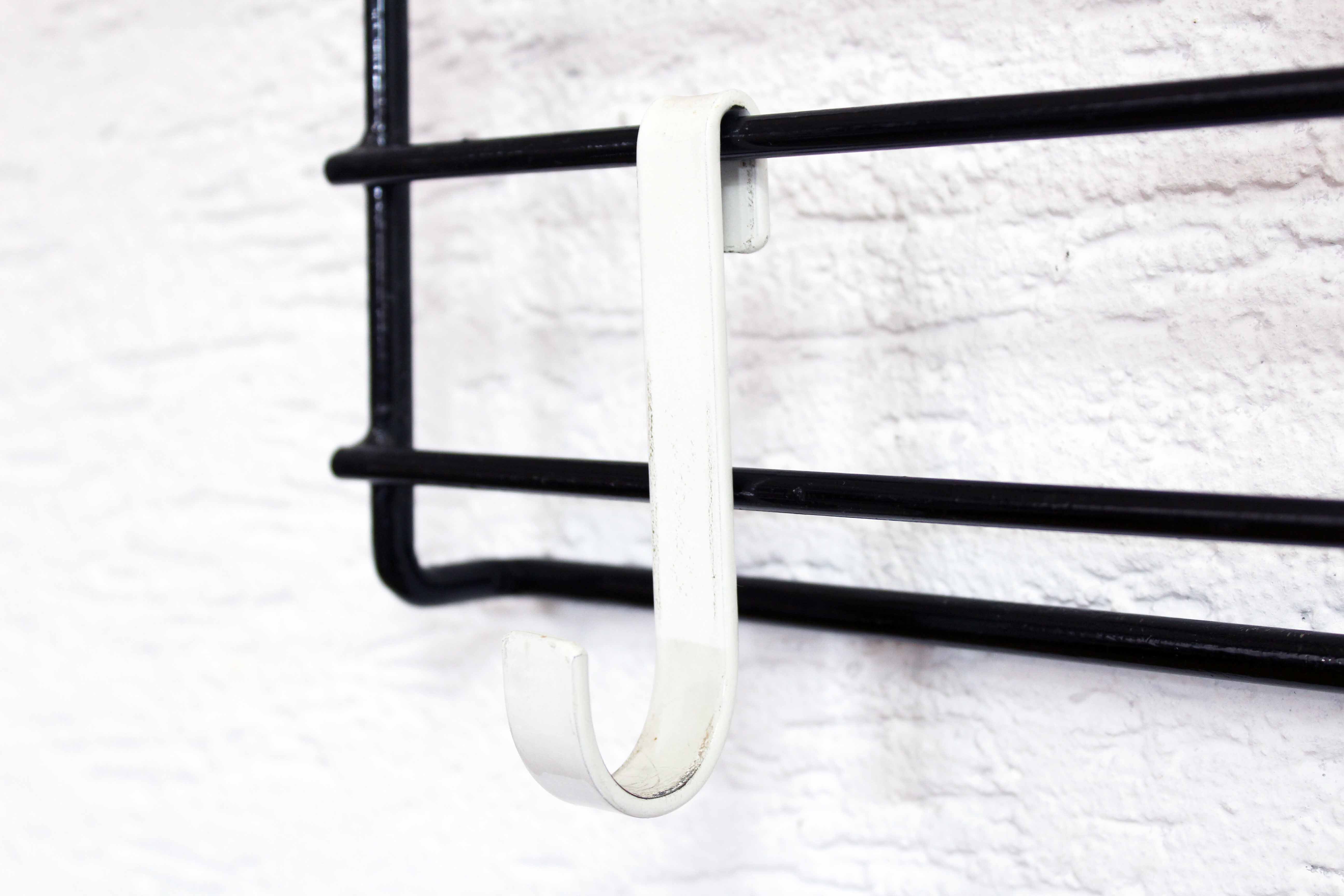 Wall coat rack with removable hooks