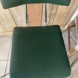 Pair of green faux leather chairs