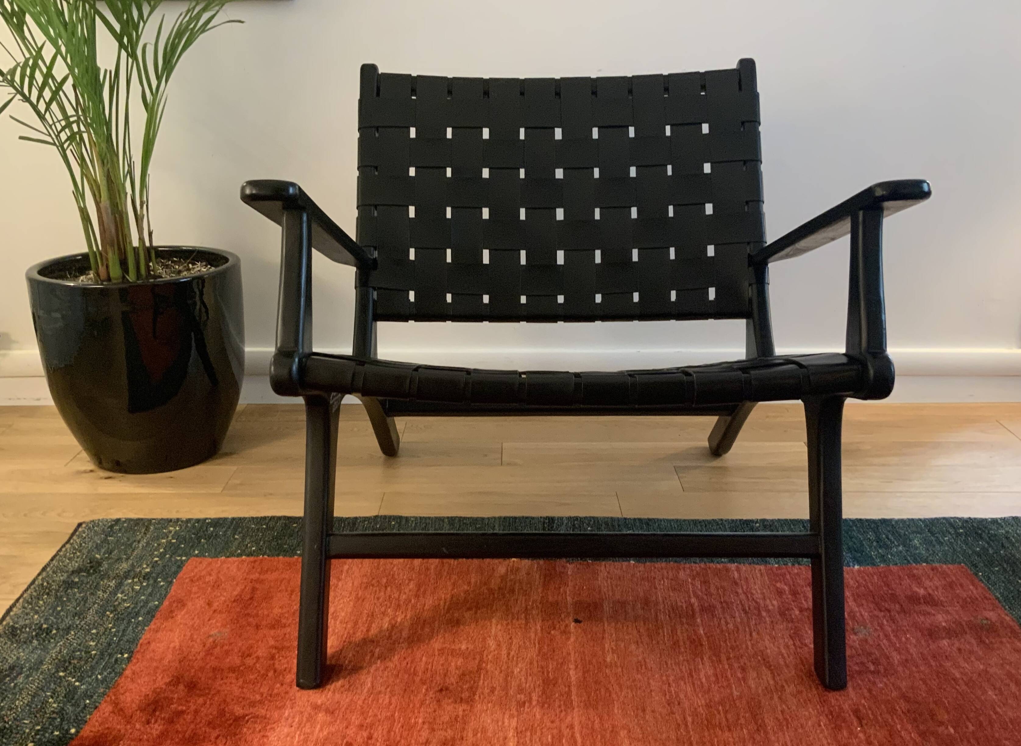 Two numbered black leather designer armchairs – Olivier De Schrijver