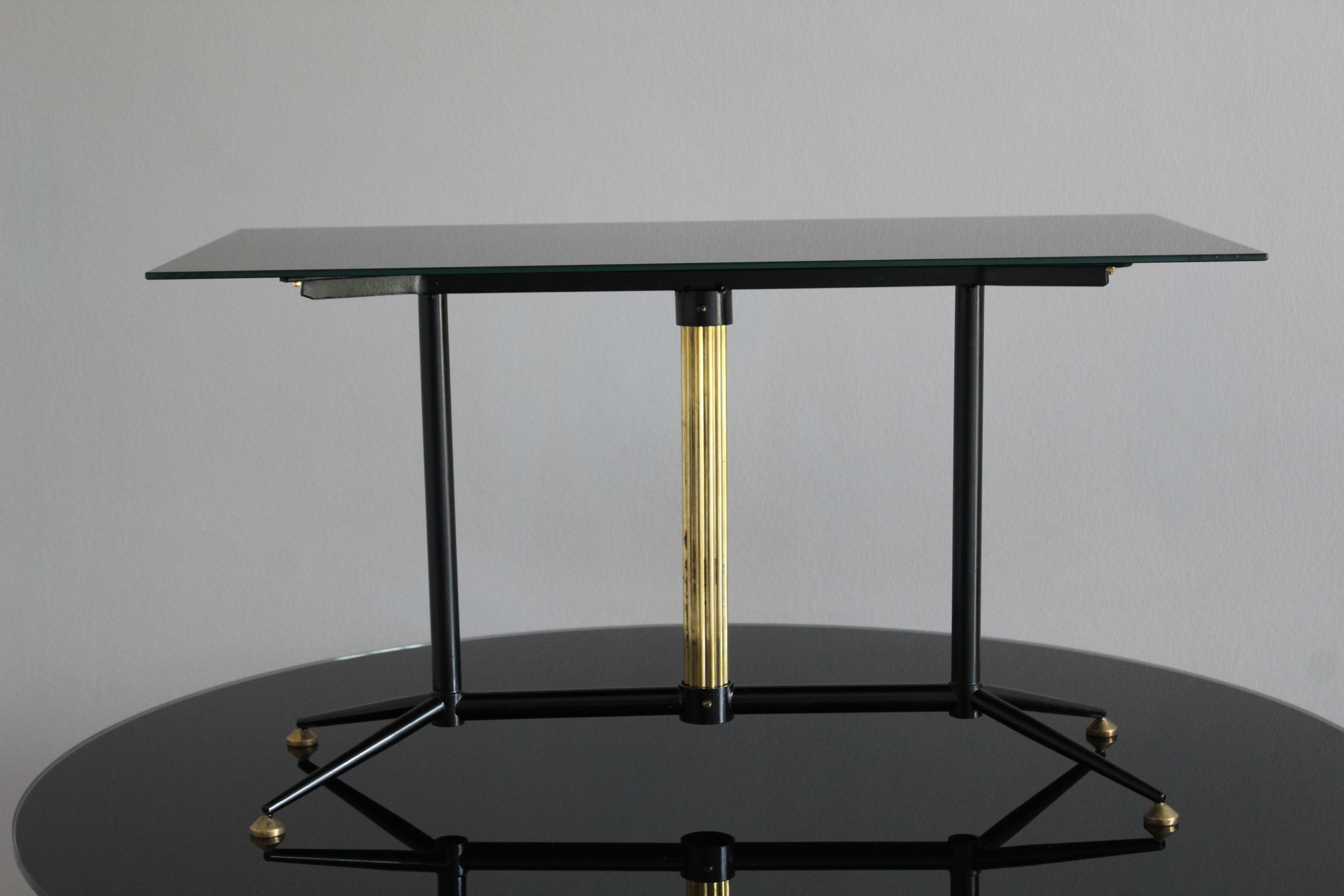 Coffee table in black glass lacquered brass and iron, Italy 50s
