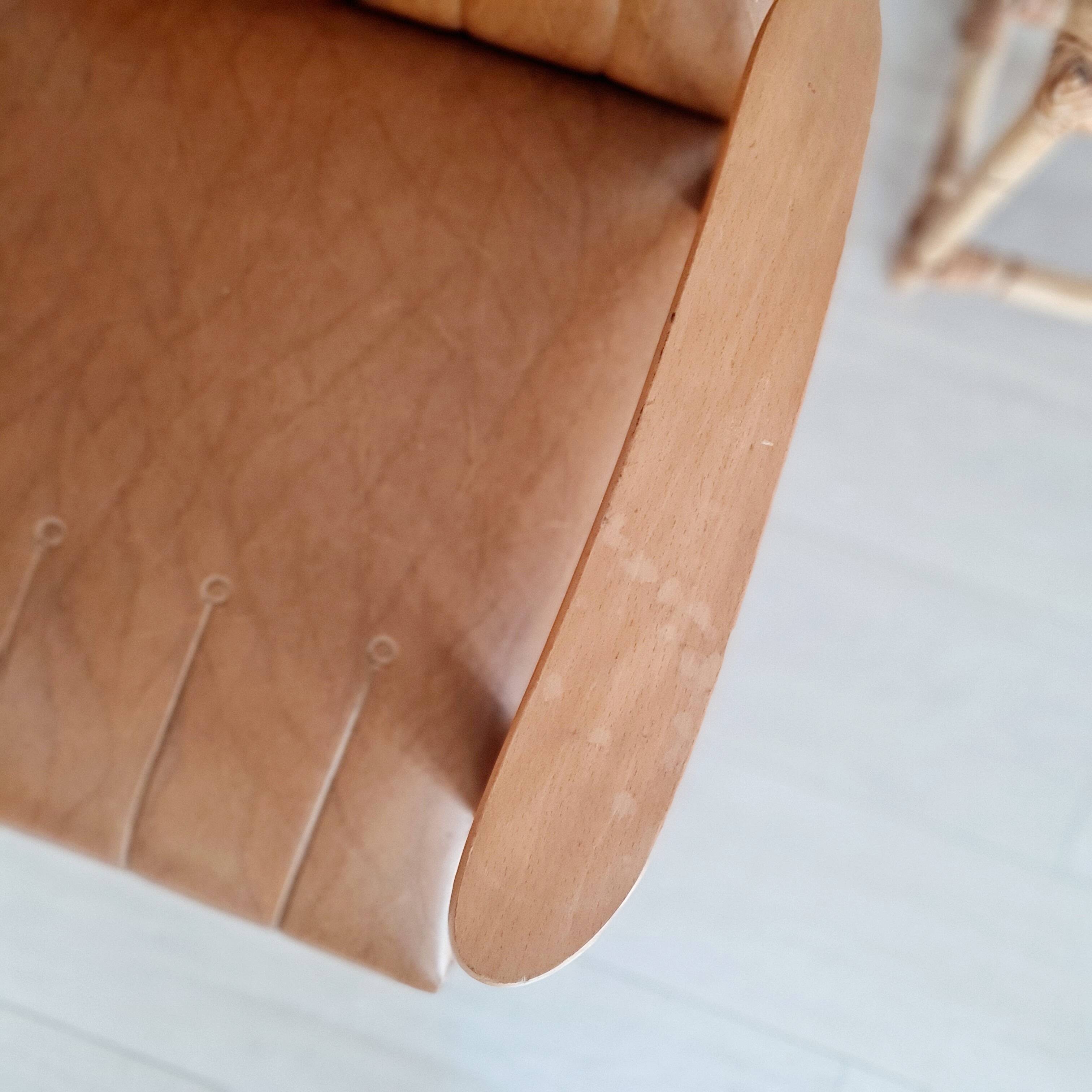 Scandinavian armchair with camel compass legs