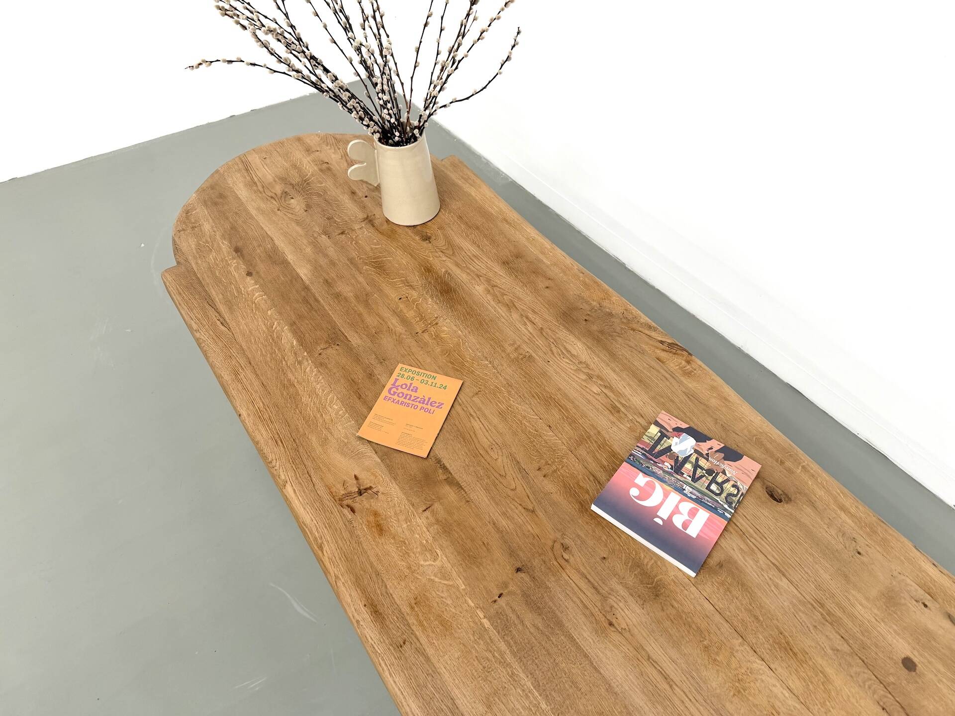 XXL oval coffee table in solid oak, cylindrical base, 1950s.