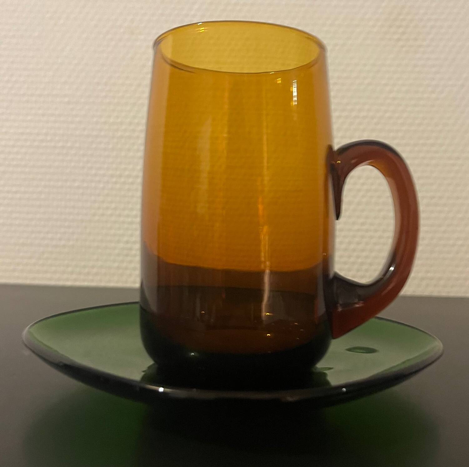 3 amber cups and green saucer
