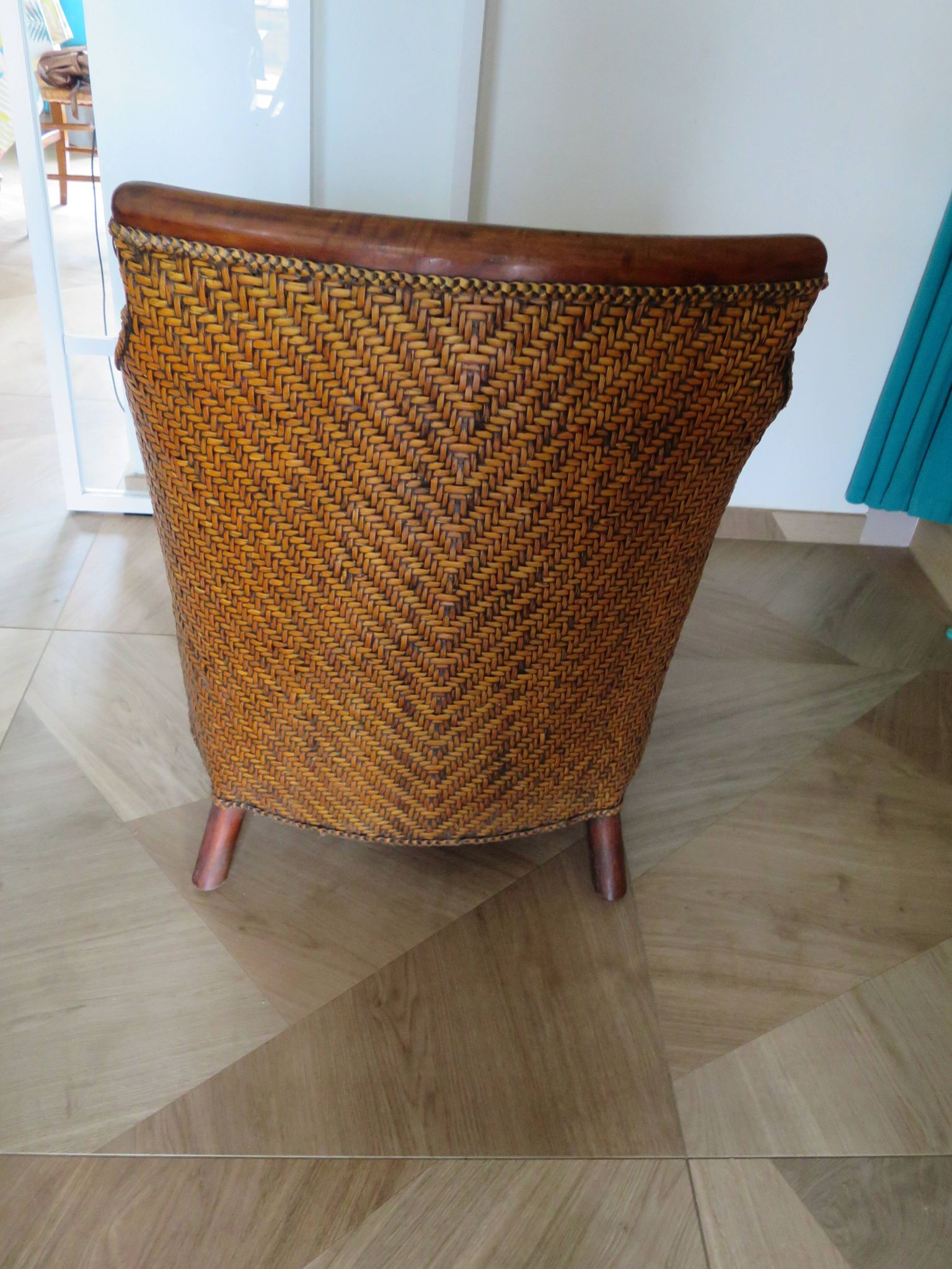 Woven rattan armchair and exotic wood in colonial style, 1980s.