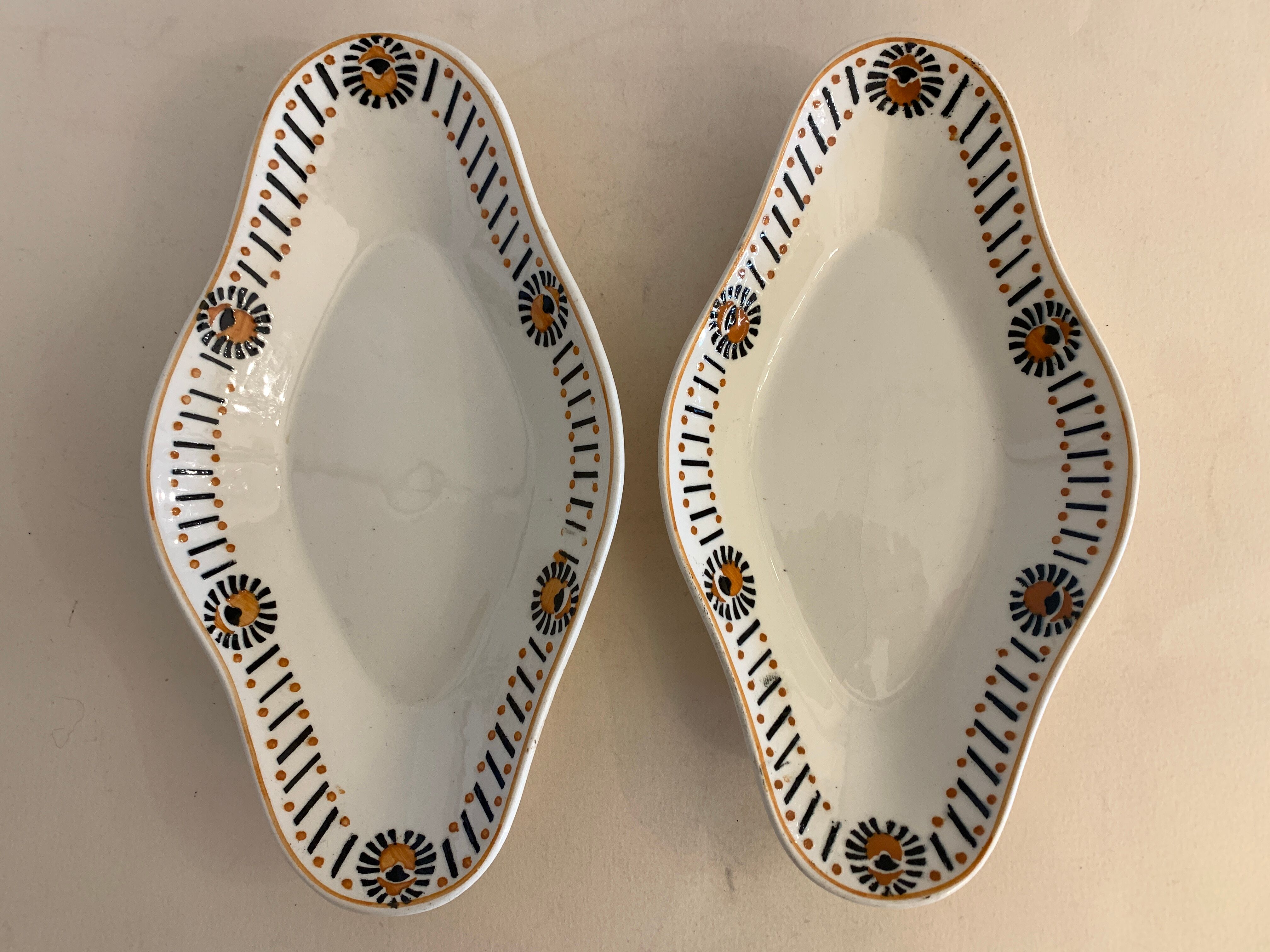 Pair of art deco raviers signed Longwy and numbered, model Gerazine