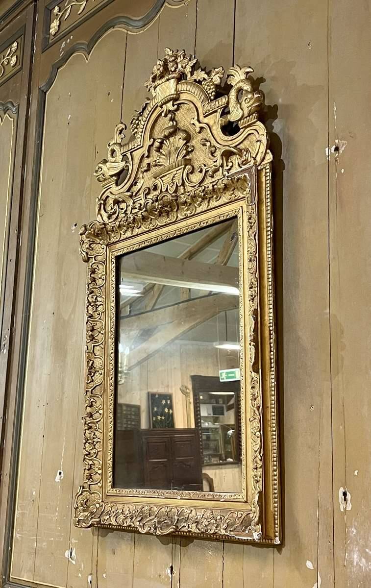 18th century Regency mirror in gilded wood