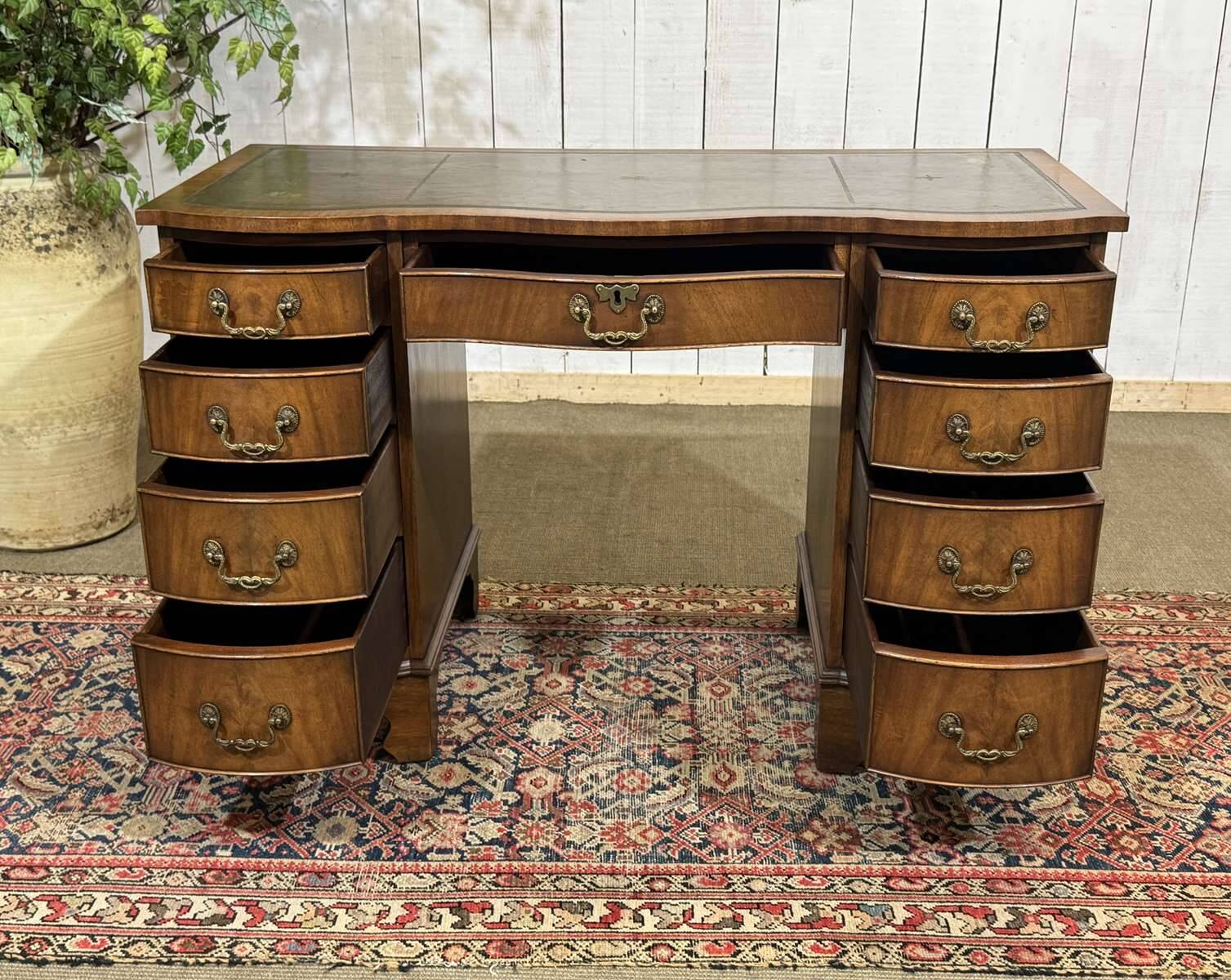 English desk from the 1950s in mahogany with a leather top.