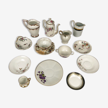 Ensemble de tasses, sous-tasses et pots à lait porcelaine de Limoges