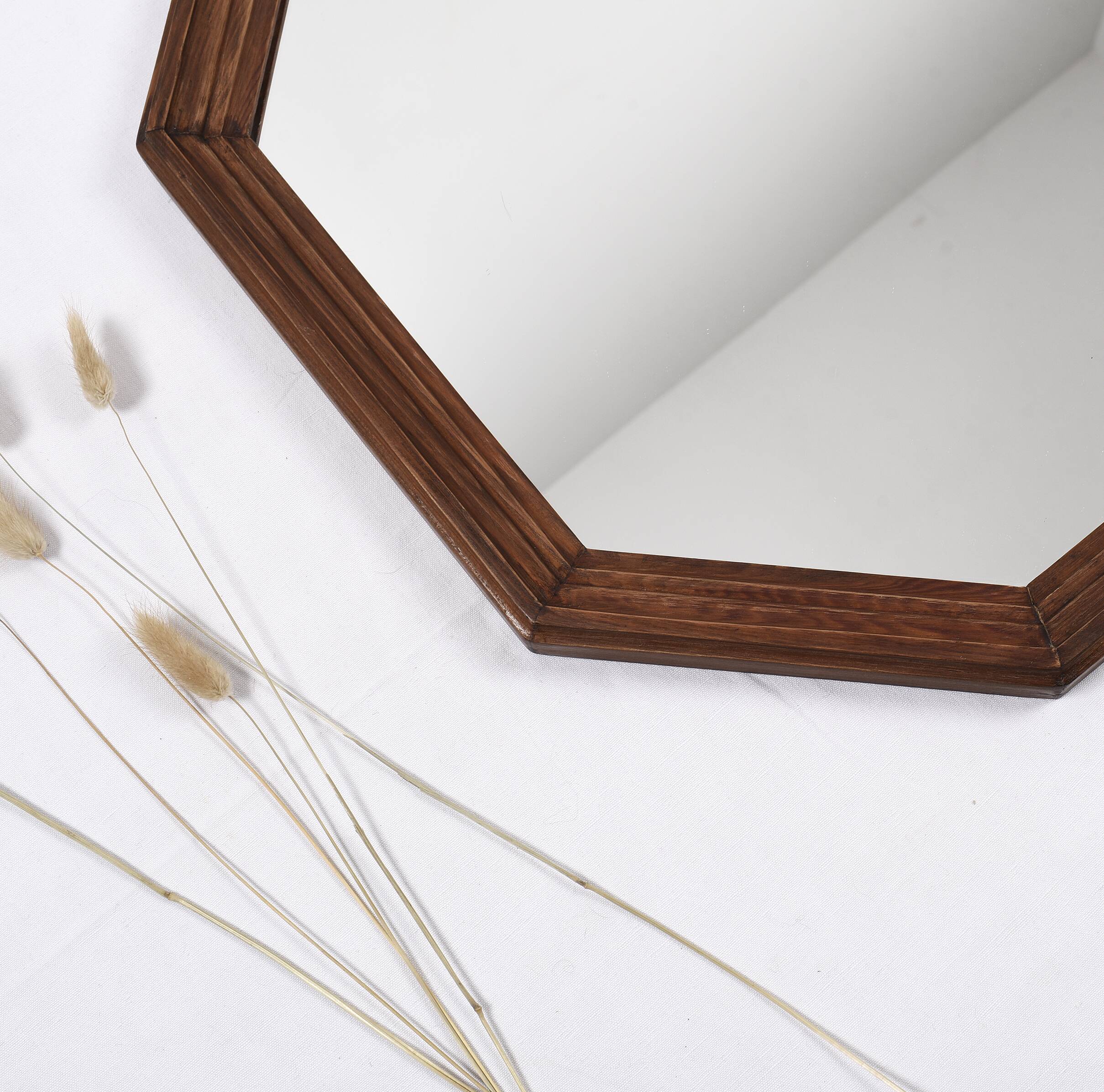 Old second-hand wooden mirror, octagonal shape.