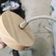 Suspension old opaline globe and petals linen and rattan