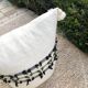 Pouf de sol en laine "a cheval"