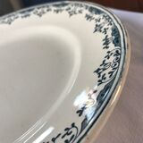 Round serving dish from the Longchamp earthenware factory, Doria model. Iron Land
