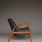 Fauteuil Seal en cuir et teck Ib Kofod-Larsen pour OPE, Suède, années 1960.