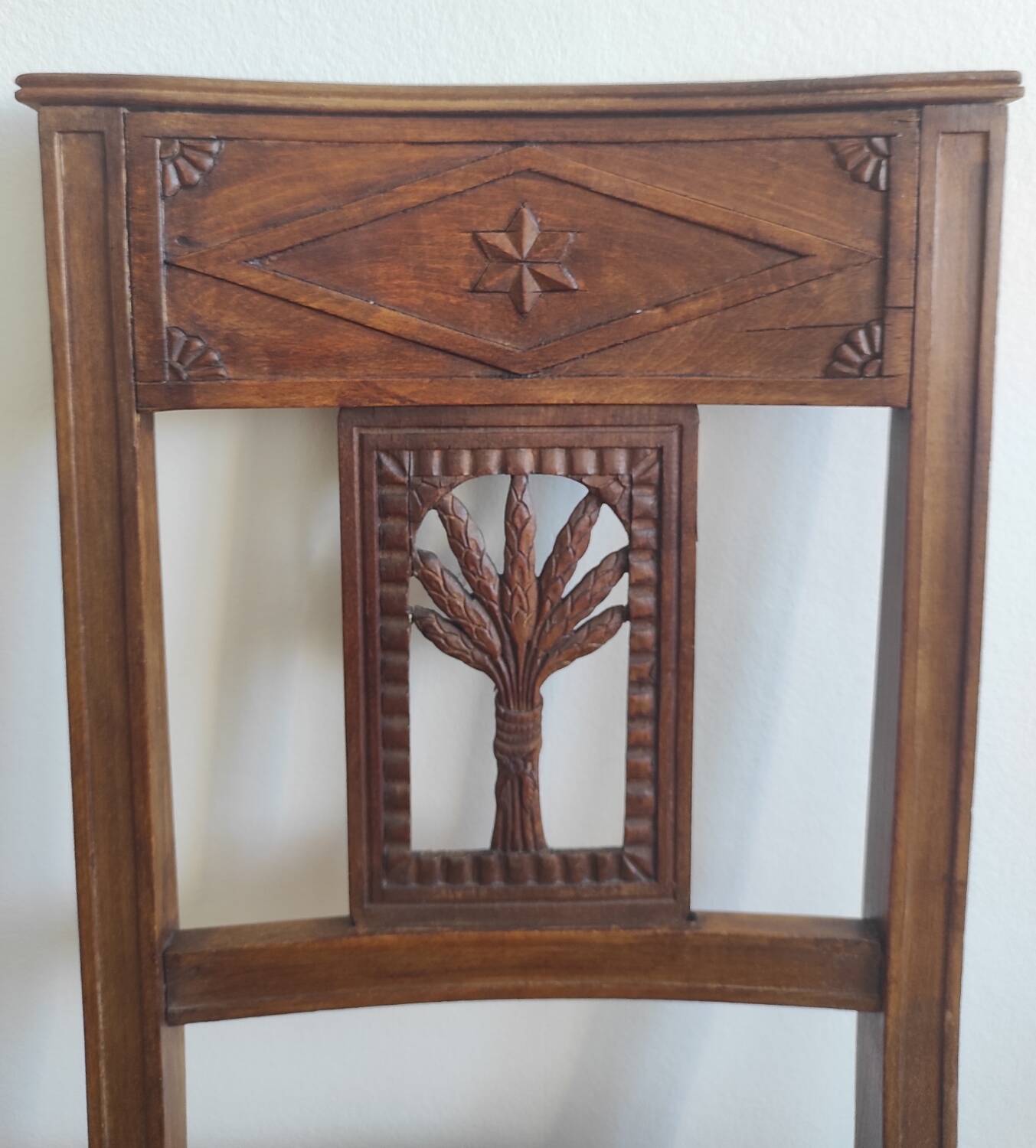 Armchair, low carved chair from the 19th century - decorated with wheat ears.