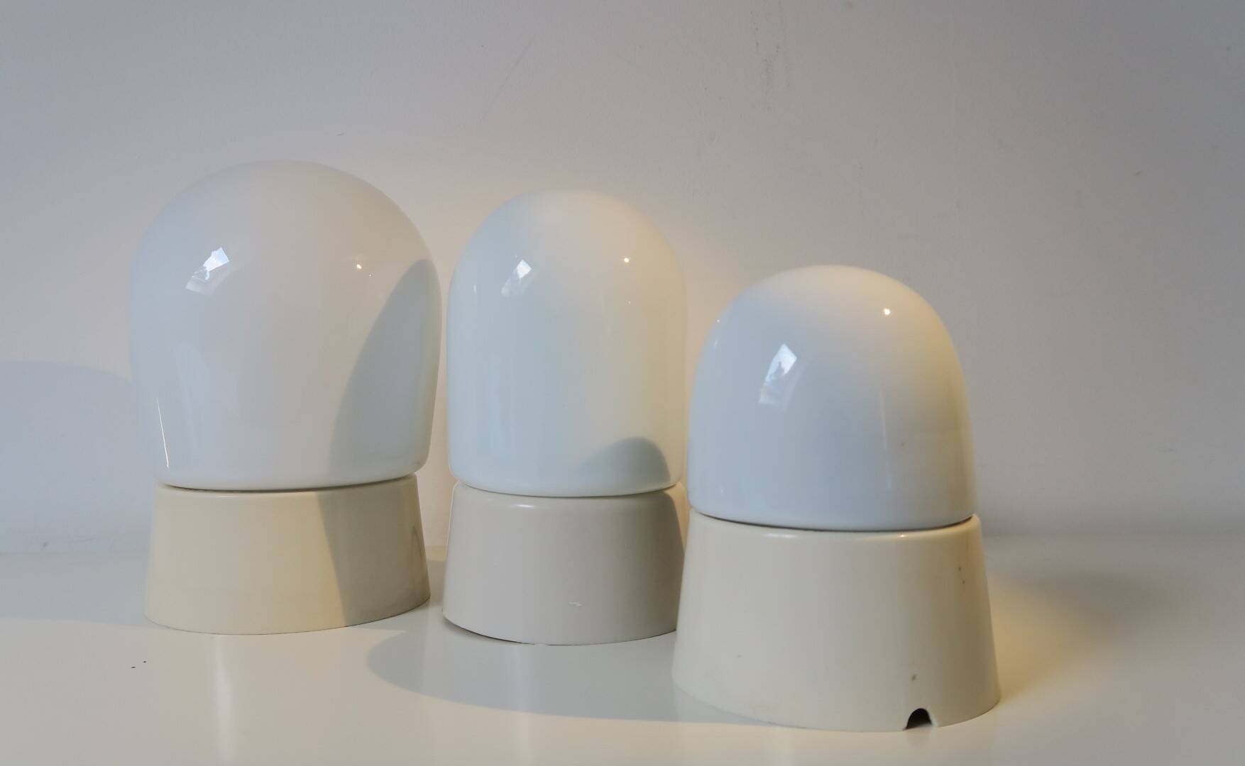 three wall sconces/ceiling lights, 1950s. Glass and Bakelite