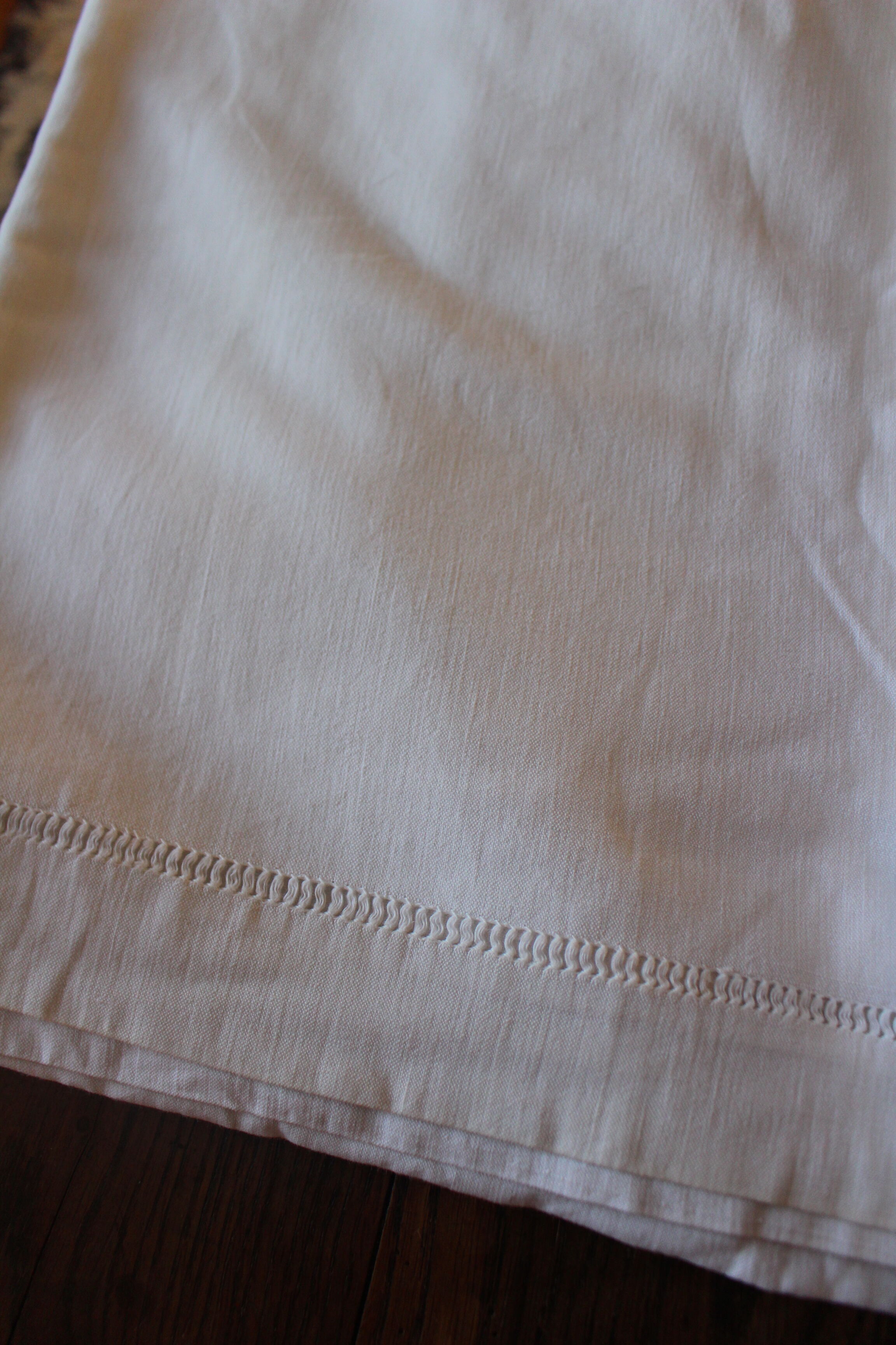 White sheet Monograms G R days scales