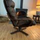 Vintage leather armchair with wooden armrests