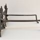 Pair of bronze andirons with black patina, 19th century, female caryatids