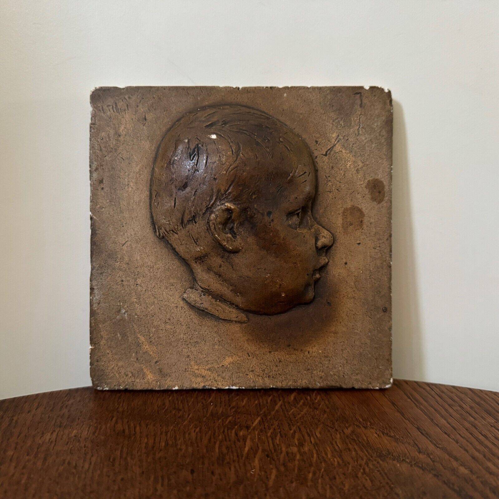 Workshop plaster medallion by Ch. Filleul, head of a young child, 20th century