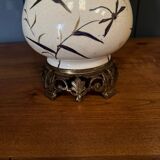 Porcelain lamp in the Indochinese style enhanced with gilding