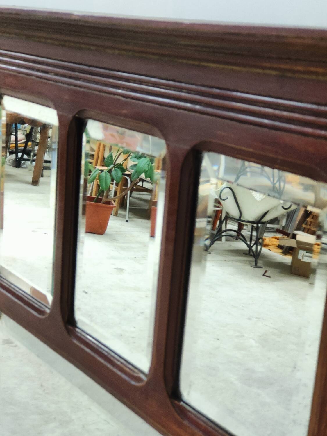 Antique beveled mirror on a wooden frame, 1930