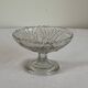 Small vintage footed bowl, made of clear moulded glass.