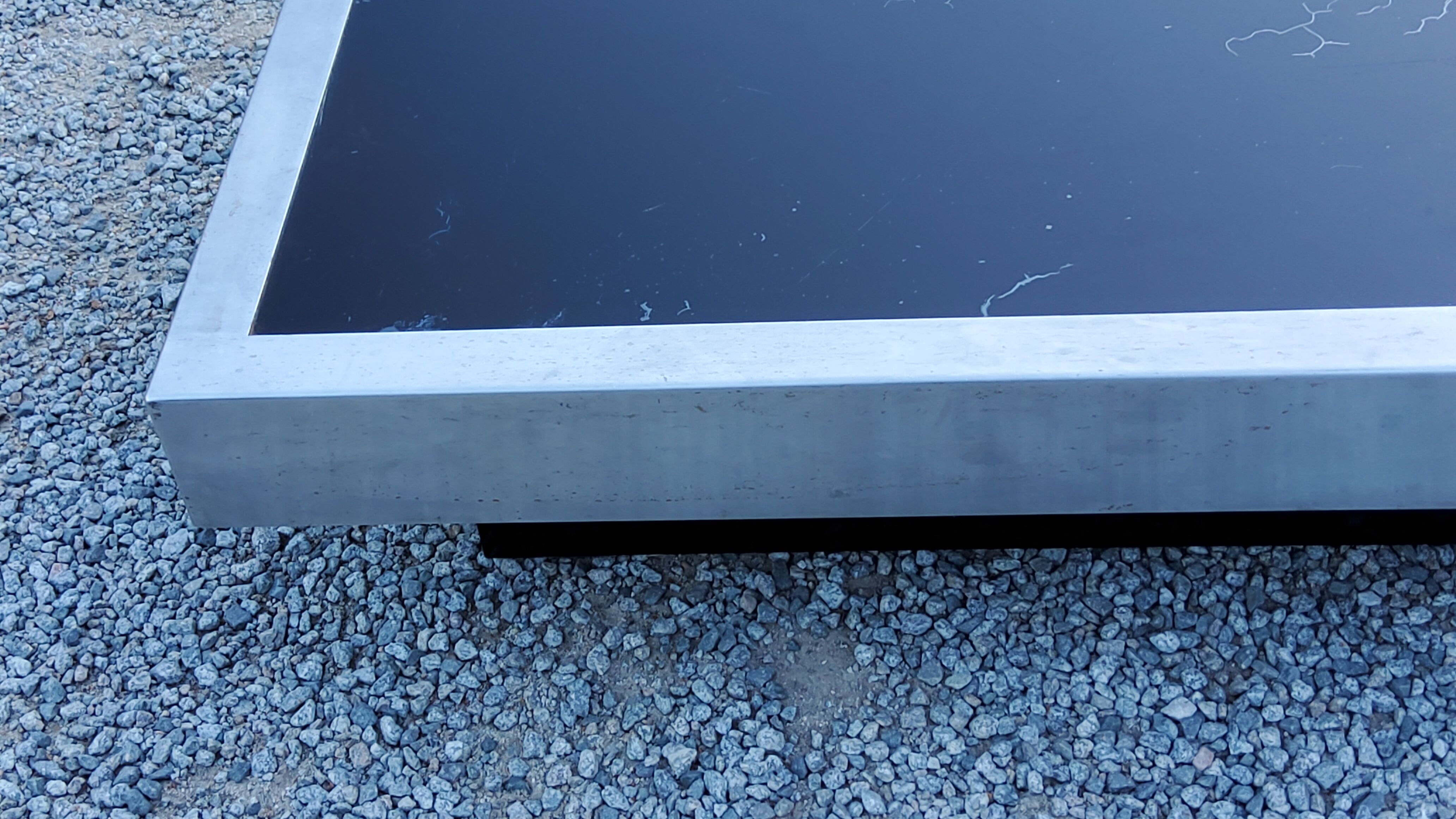 Coffee table in brushed steel and black tinted glass from the 70s
